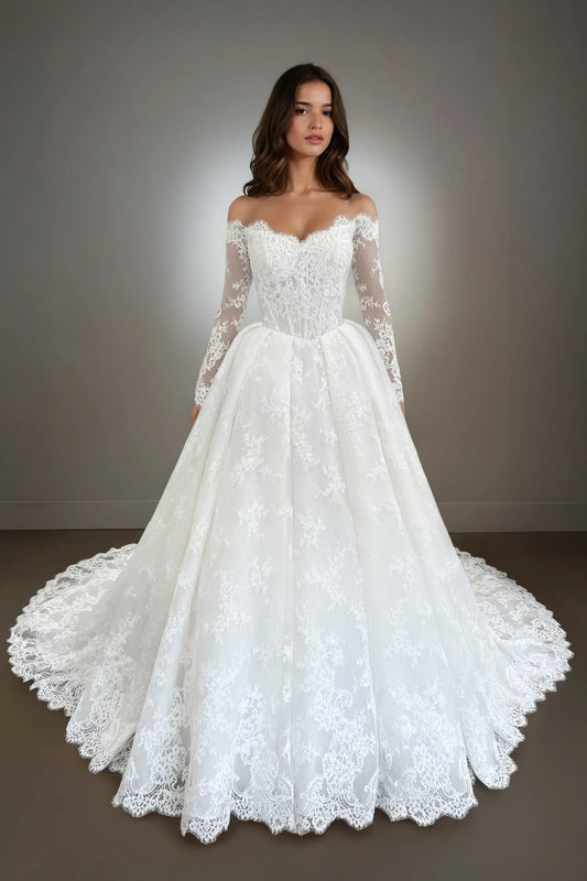 Front view of the Annabelle long sleeve lace ball gown wedding dress featuring an off-the-shoulder neckline, drop waist, and corded French lace.