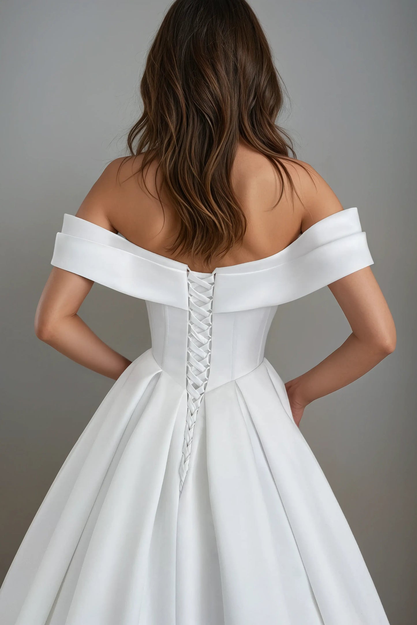 Back view of the Solana satin A-line wedding dress featuring a structured corset and off-the-shoulder neckline